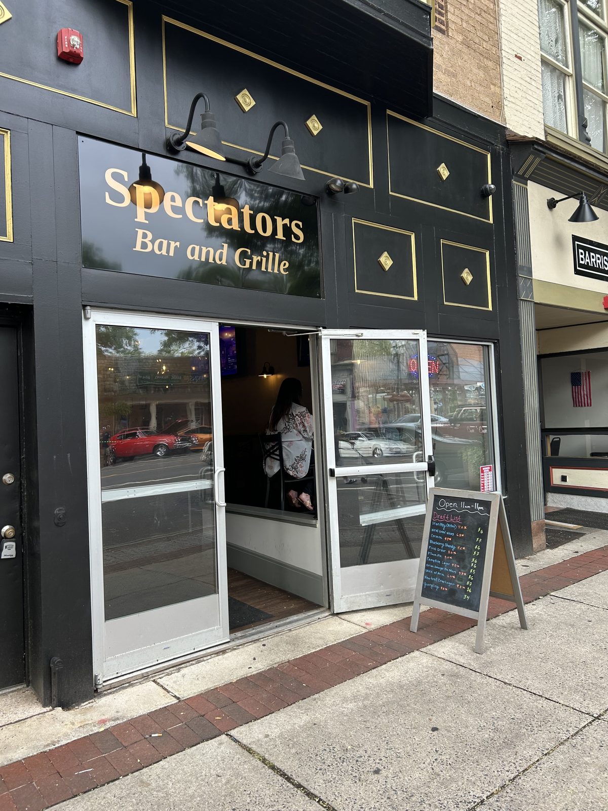 Spectators Bar & Grille storefront on East High Street in downtown Pottstown, PA