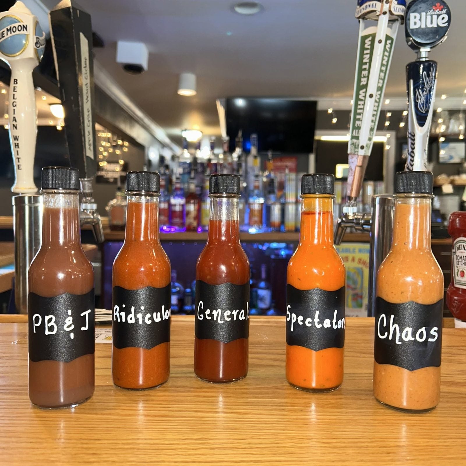 Row of house-made wing sauces at Spectators in Pottstown, PA &mdash; part of 50+ flavors
